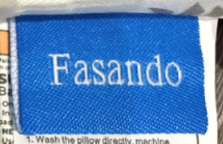 Fasando label stitched on the outside of the baby lounger cover