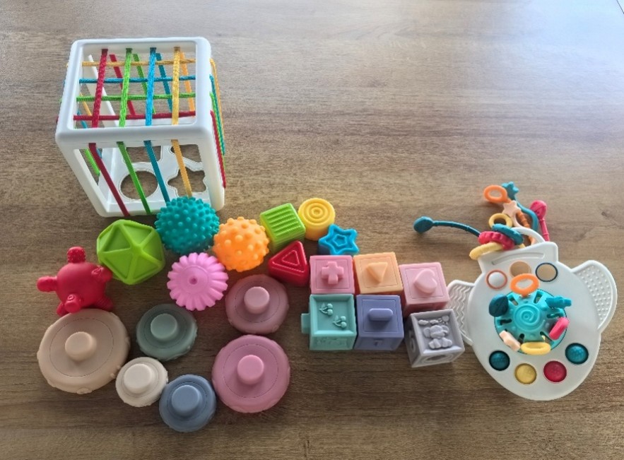 5-in-1 toy set with airplane-shaped pull-string teether. Official CPSC identification image for SpringFlower 5-in-1 Montessori Toy Set.